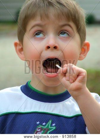 Boy Eating Lollipop