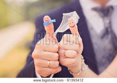 happy couple in love with painted smiley and hugging
