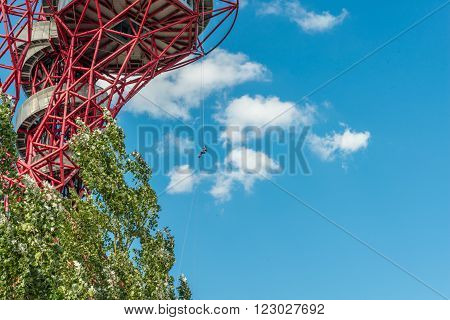 London United Kingdom - August 22 2015:Abseiling experience in ArcelorMittal Orbit Queen Elizabeth Park. People slowly riding down to the ground using a rope