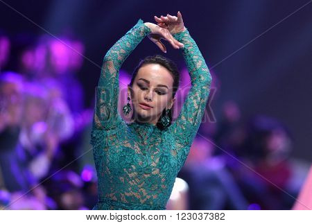 Sofia Bulgaria - March 23 2016: A model dances at the runway at Sofia Fashion Week runway show. The fashion show is held for a second time in Bulgaria's capital.