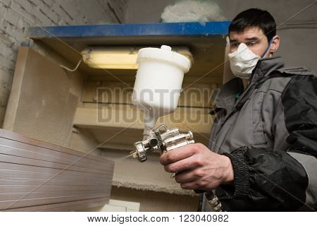 Carpenter Painter Paints The Furniture Board With A Spray Gun On The Production Line Small Wholesale
