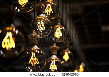 Group of lamps with interesting shape of tungsten filament.