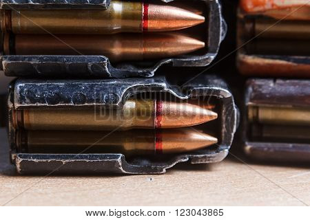 7.62 ammo for machine guns with loaded magazines on table