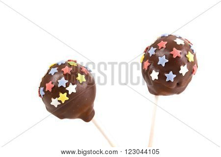 Two cakepops with stars decoration on isolated background