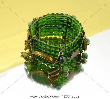 Oriental beads bracelet on ...... mirrorlike background