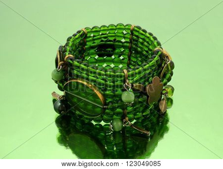 Oriental beads bracelet on ...... mirrorlike background