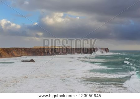 Sagres fortress in stormy day and giant waves. Portugal