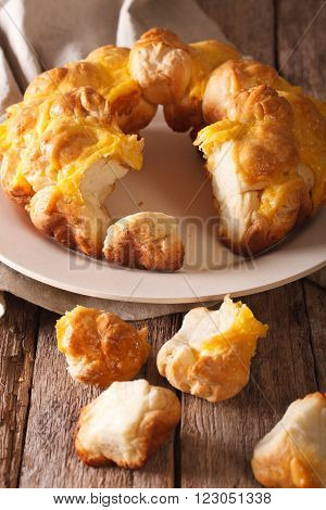 Cut Monkey Bread With Cheese Close-up On A Plate. Vertical
