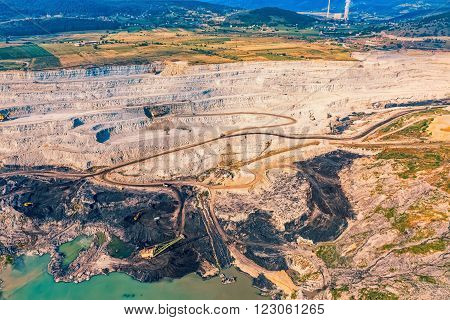Helicopter shoot of the stone quarry on the sunny summer morning.