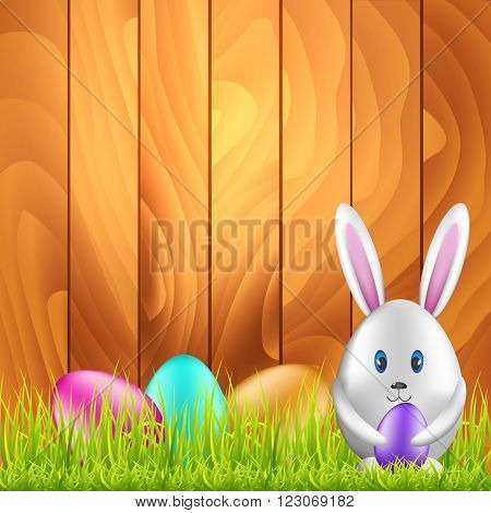 Easter bunny egg and colorful eggs on spring meadow. Easter background with space for text. Vector illustration