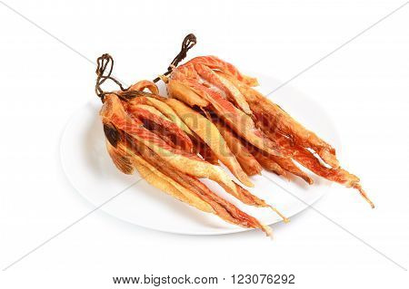 smoked salmon bellies on plate isolated on white.