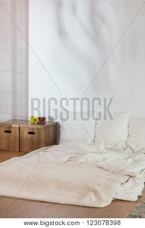 Simple Bed In Raw Modest Bedroom