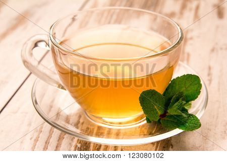 Green tea in a cup and mint