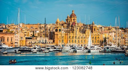 view on Birgu and the harbour with boats