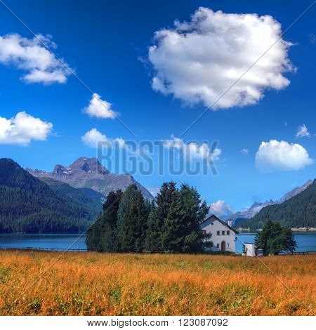 Amazing sunny day at Champferersee lake in the Swiss Alps. Silvaplana village, Switzerland, Europe.