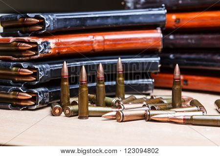 7.62 ammo for machine guns with loaded magazines on table