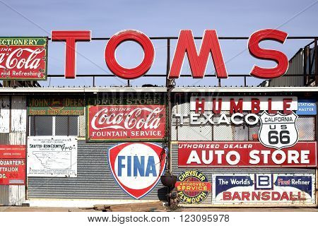 BARSTOW, CALIFORNIA - DECEMBER 22: A workshop with a large number of old vintage and retro label signs of different brands on December 22 2015 in Barstow.