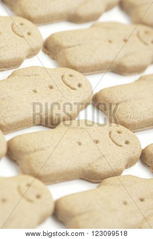 A row of ginger bread men on white background.