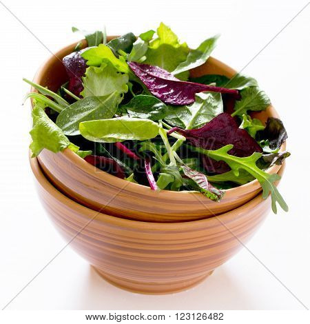Mix Salad Arugula, Spinach, Chard, Oak Salad In Ceramic Cup On A White Background