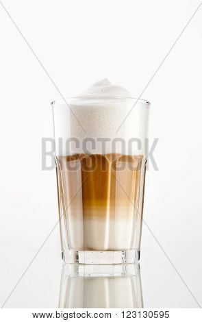 Latte Macchiato coffee in a glass isolated on white background