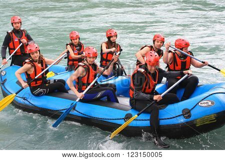 Foca, Bosnia, jun 2. 2015. Group of happy people with guide whitewater rafting and rowing on river
** Note: Visible grain at 100%, best at smaller sizes