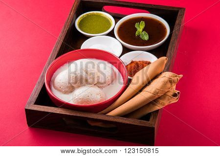 dahi vada or dahi vade also known as Curd Vadai in South India, a popular snack famous all over India prepared by soaking lentil vadas in thick dahi or yogurt, topped with spicy & sweet chutney etc