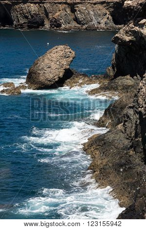 Wave Splashing Over A Rock On Caleta Negra Beach In Ajuy On Fuerteventura. Canary Island Spain
