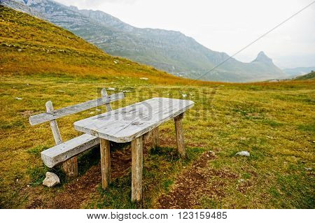 Empty wooden bench and table on Sedlo Pass in Durmitor National Park in Montenegro