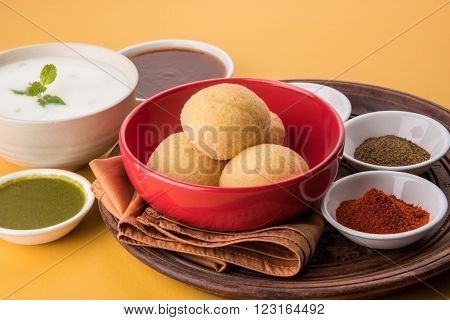 dahi vada or dahi vade also known as Curd Vadai in South India, a popular snack famous all over India prepared by soaking lentil vadas in thick dahi or yogurt, topped with spicy & sweet chutney etc