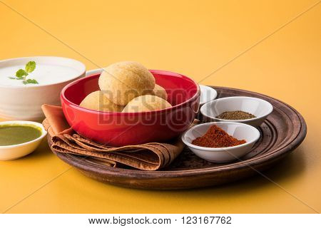 dahi vada or dahi vade also known as Curd Vadai in South India, a popular snack famous all over India prepared by soaking lentil vadas in thick dahi or yogurt, topped with spicy & sweet chutney etc