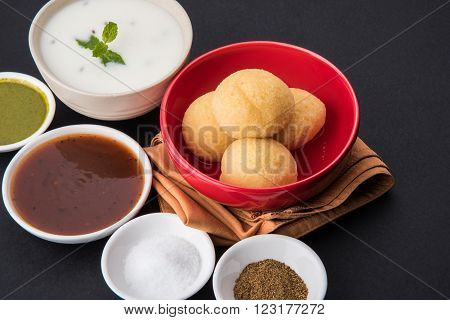 dahi vada or dahi vade also known as Curd Vadai in South India, a popular snack famous all over India prepared by soaking lentil vadas in thick dahi or yogurt, topped with spicy & sweet chutney etc