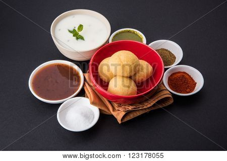 dahi vada or dahi vade also known as Curd Vadai in South India, a popular snack famous all over India prepared by soaking lentil vadas in thick dahi or yogurt, topped with spicy & sweet chutney etc