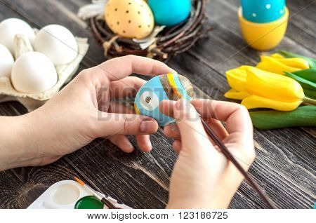 Children paint Easter eggs at home / happy easter