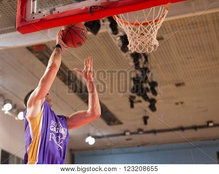 SAMARA RUSSIA - NOVEMBER 06, 2013: BC Royal Hali Gaziantep player throws the ball in a basket during the BC Krasnye Krylia game on November 06 2013 in Samara Russia.