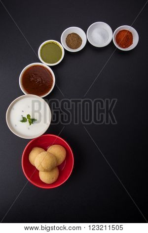 dahi vada or dahi vade also known as Curd Vadai in South India, a popular snack famous all over India prepared by soaking lentil vadas in thick dahi or yogurt, topped with spicy & sweet chutney etc