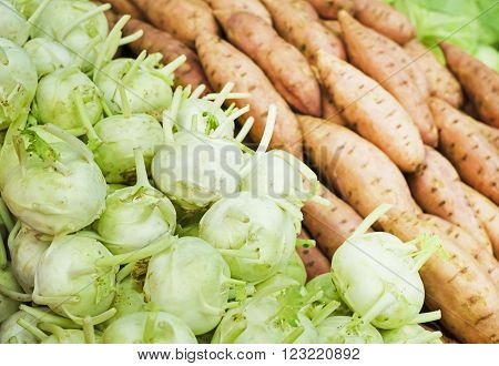 fresh green kohlrabi cabbage and yam on market
** Note: Shallow depth of field