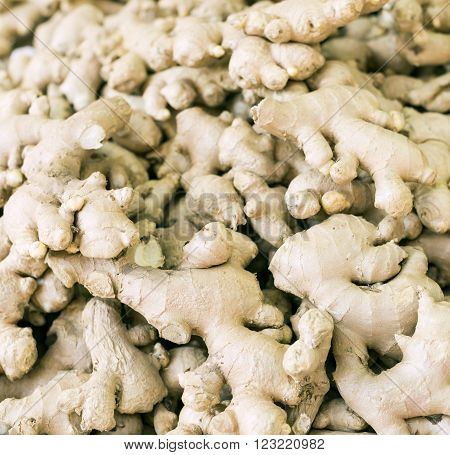 Roots of ginger offered for sale on a market.
** Note: Shallow depth of field