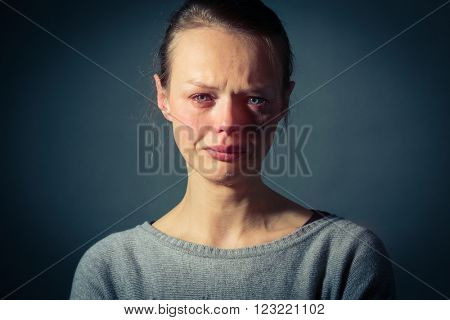 Young woman suffering from severe depression/anxiety/sadness