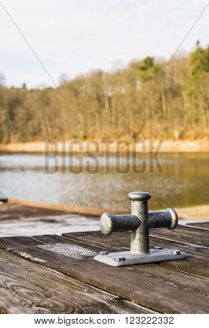 Bitt mooring on the pier over the lake.