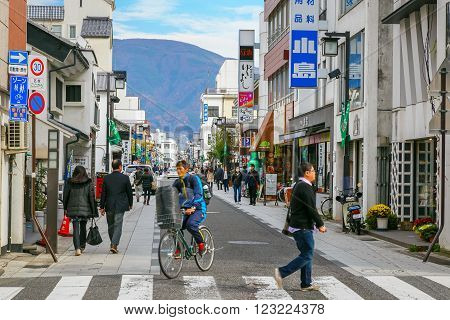 MATSUMOTO JAPAN - NOVEMBER 21 2015: Nakamachi Street is a beautiful street with nice little shops cafes with some nice food and cocktails many historical buildings still found here