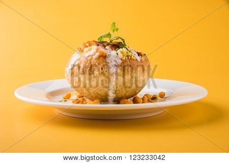 Rajasthani Shahi Raj Kachori, stuffed katchori with potato and sprout filling and served with curd, chutney and sev