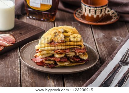 Pancakes with bacon banana and maple sirup delicious and simple breakfast