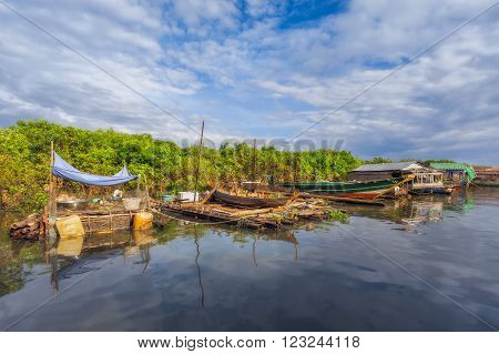SIEM REAP, CAMBODIA DEC. 16: Cambodian people live on Tonle Sap Lake in Siem Reap, Cambodia on December 16, 2011. The village on the water. Tonle sap lake.