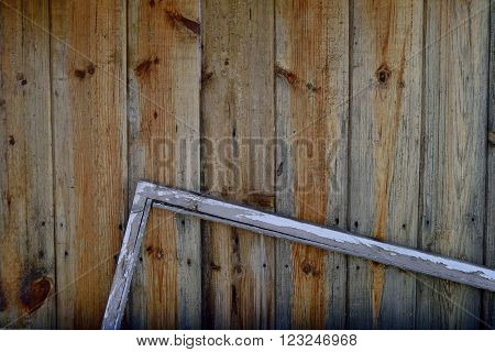 wooden planks with a broken window frame