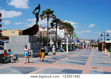 TORREMOLINOS, SPAIN - JUNE 2, 2008 - Tourists walking along the promenade Torremolinos Costa del Sol Malaga Province Andalusia Spain Western Europe, June 2, 2008.