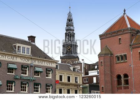 AMSTERDAM; THE NETHERLANDS - AUGUST 16; 2015: View of Oude Kerk (Old Church) from Damrak canal. Amsterdam is capital of the Netherlands on August 16; 2015.