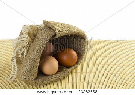 Open Linen Sack of Eggs Isolated on White Background
