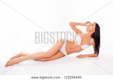 Sexy Slim Model In Lingerie Lying On White Background