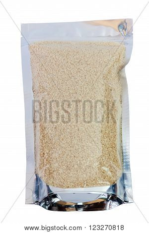 White sesame seeds in packaging foil zip lock bag. Isolated on white