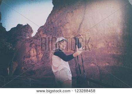 Vintage style photo of young girl creating selfie at a canyon. Old photo style with film grain.
** Note: Visible grain at 100%, best at smaller sizes